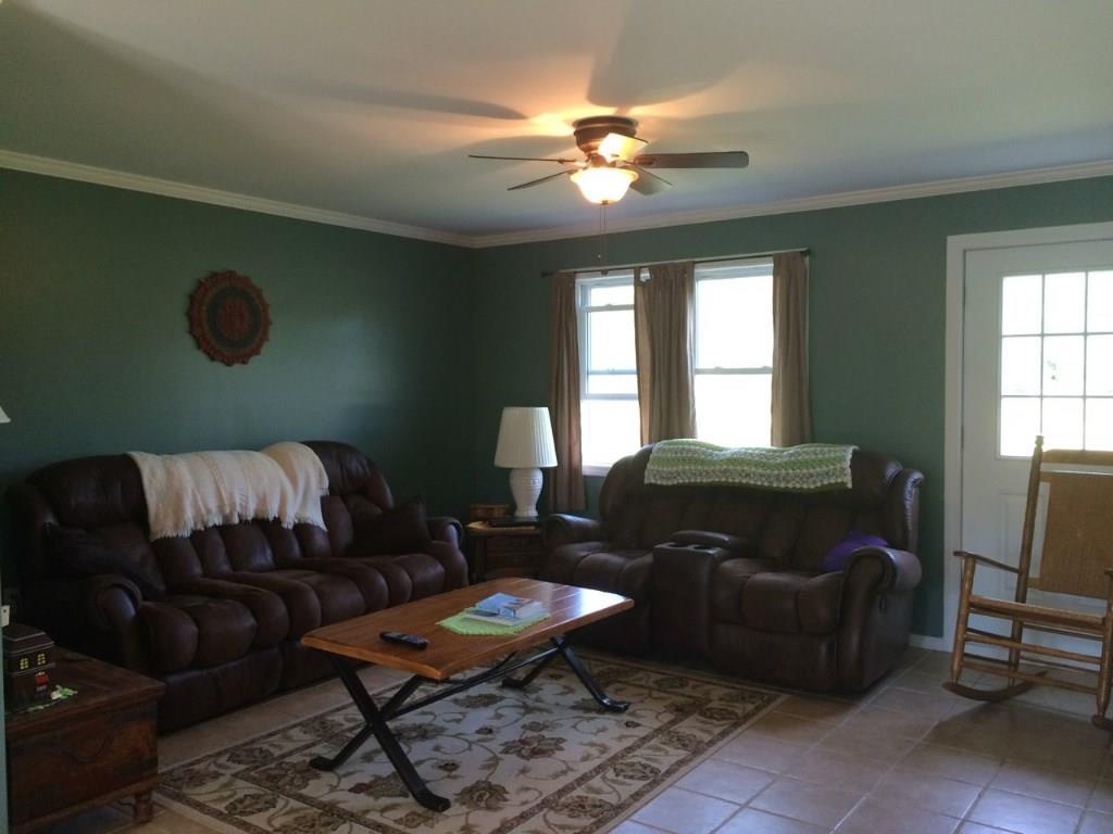 429 Sherman Road Robbinston, ME 04671 - Photo 17 of 34 Large living room features gas fireplace
