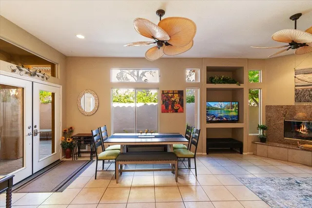 a living room with fireplace furniture and a flat screen tv