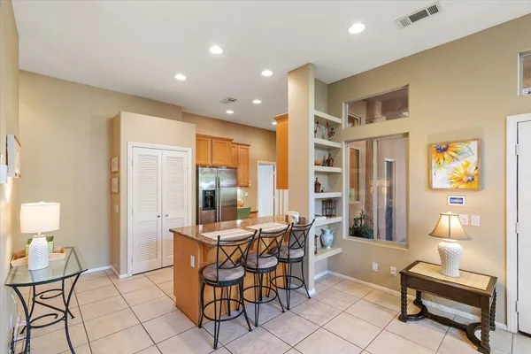 a dining room with furniture and wooden floor