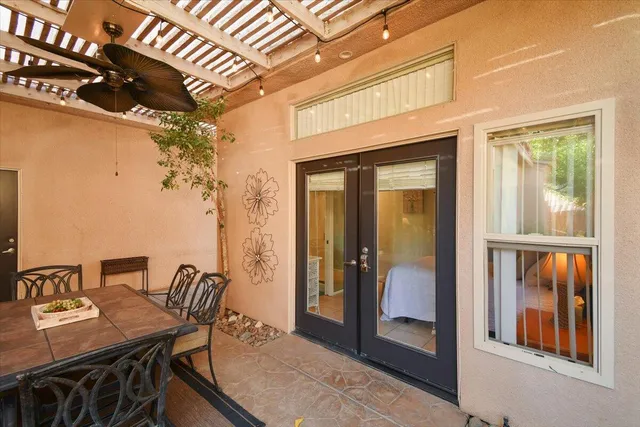 a view of a dining room with furniture and window