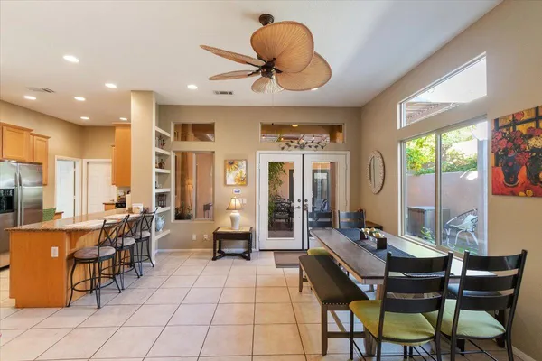 a view of a dining room with furniture window and outside view