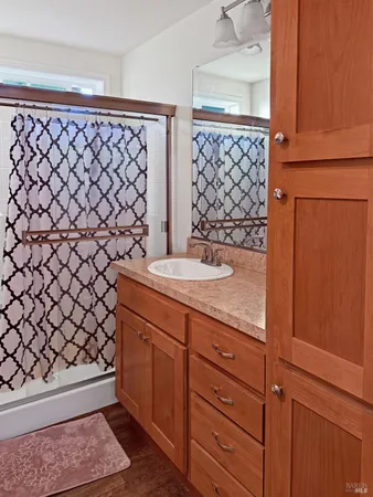 a bathroom with a sink and a mirror