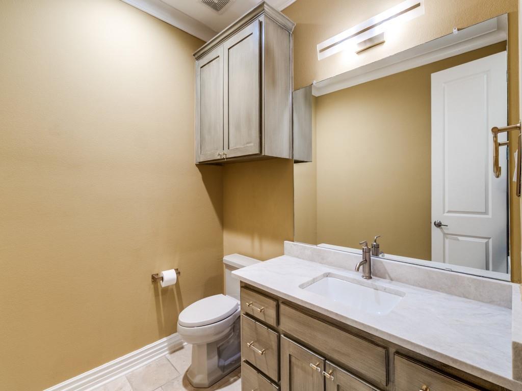 2811 Hood Street, Unit B Dallas, TX 75219 - Photo 13 of 30 a bathroom with a granite countertop sink and a mirror