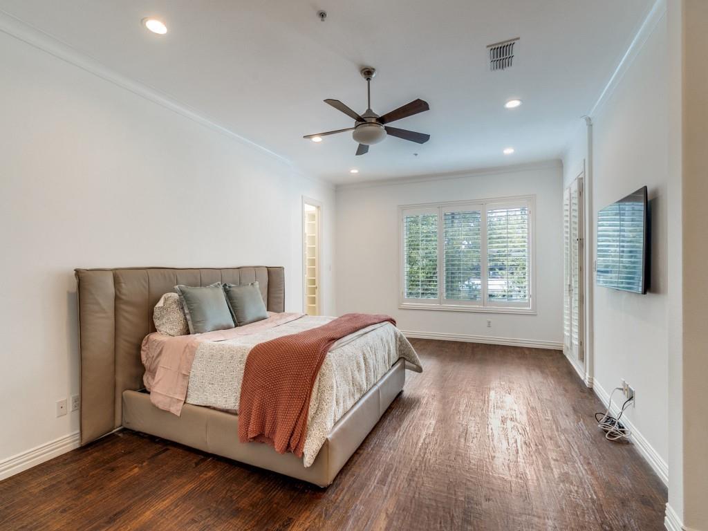 2811 Hood Street, Unit B Dallas, TX 75219 - Photo 16 of 30 a bedroom with a large bed and a window