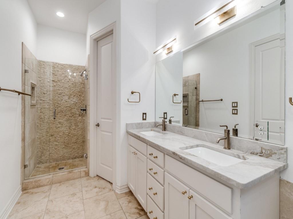 2811 Hood Street, Unit B Dallas, TX 75219 - Photo 18 of 30 a bathroom with a granite countertop sink mirror and shower
