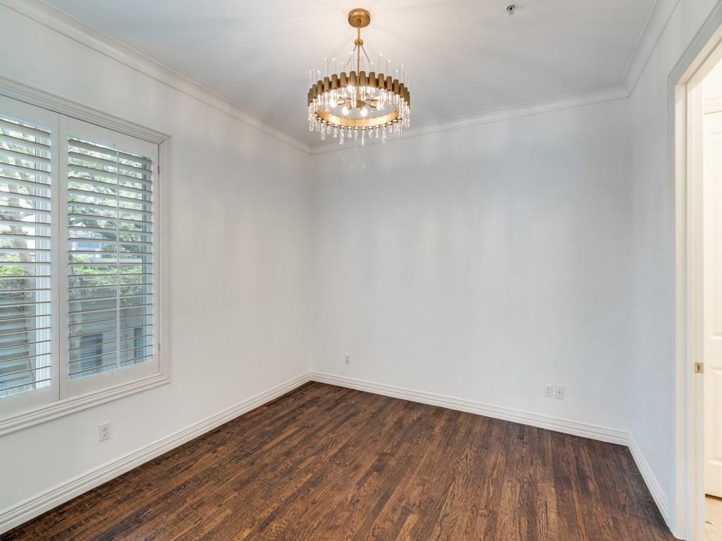 2811 Hood Street, Unit B Dallas, TX 75219 - Photo 23 of 30 a view of a room with wooden floor and a large window