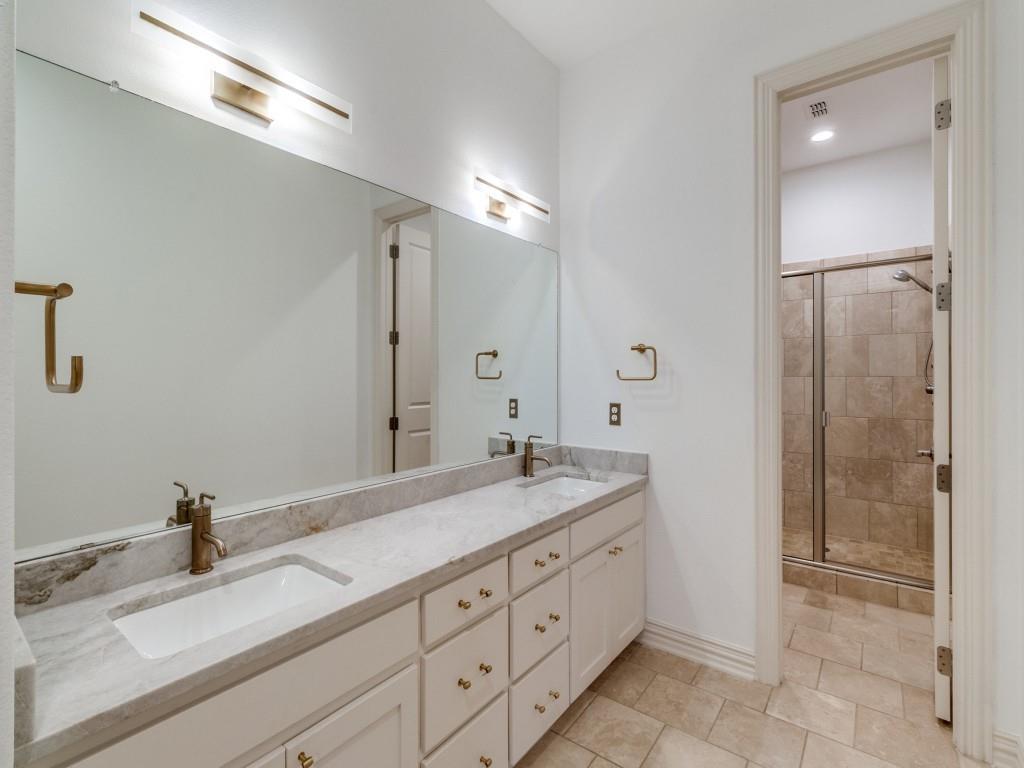2811 Hood Street, Unit B Dallas, TX 75219 - Photo 24 of 30 a bathroom with a granite countertop sink mirror and shower