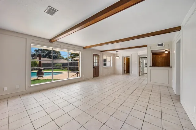a view of an empty room and window