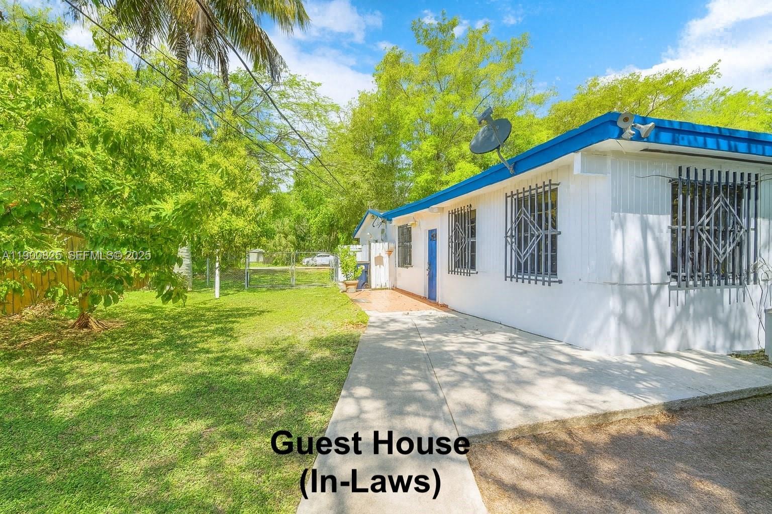 7800 Southwest 95th Street Miami, FL 33156 - Photo 11 of 17 a view of a house with a yard
