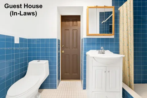 a bathroom with a toilet and a sink