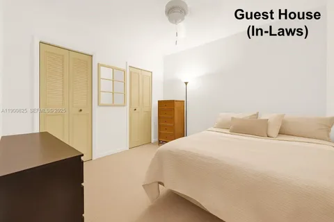 a bedroom with a bed and cabinets