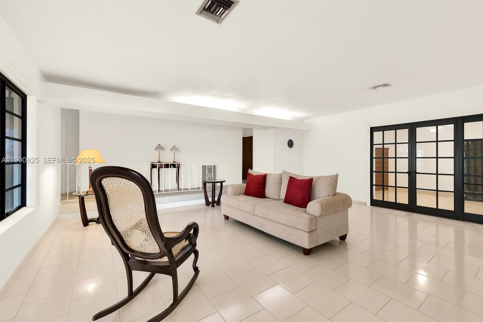 7800 Southwest 95th Street Miami, FL 33156 - Photo 2 of 17 a living room with furniture and a window