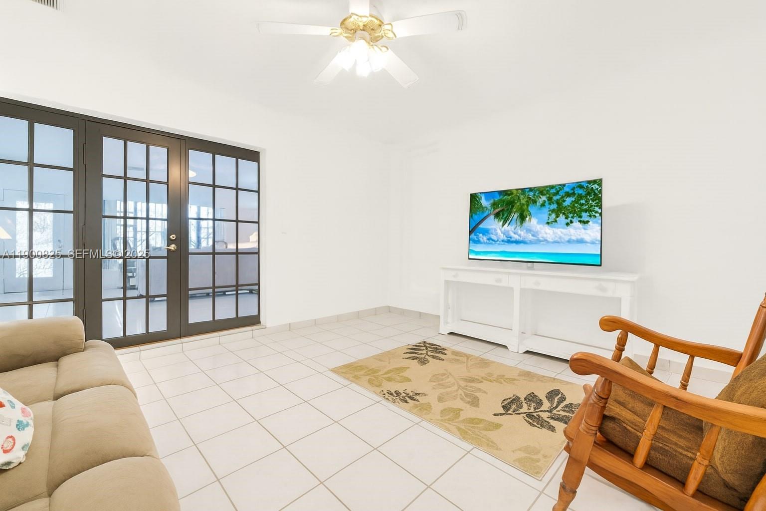 7800 Southwest 95th Street Miami, FL 33156 - Photo 5 of 17 a bedroom with a bed and a painting on the wall