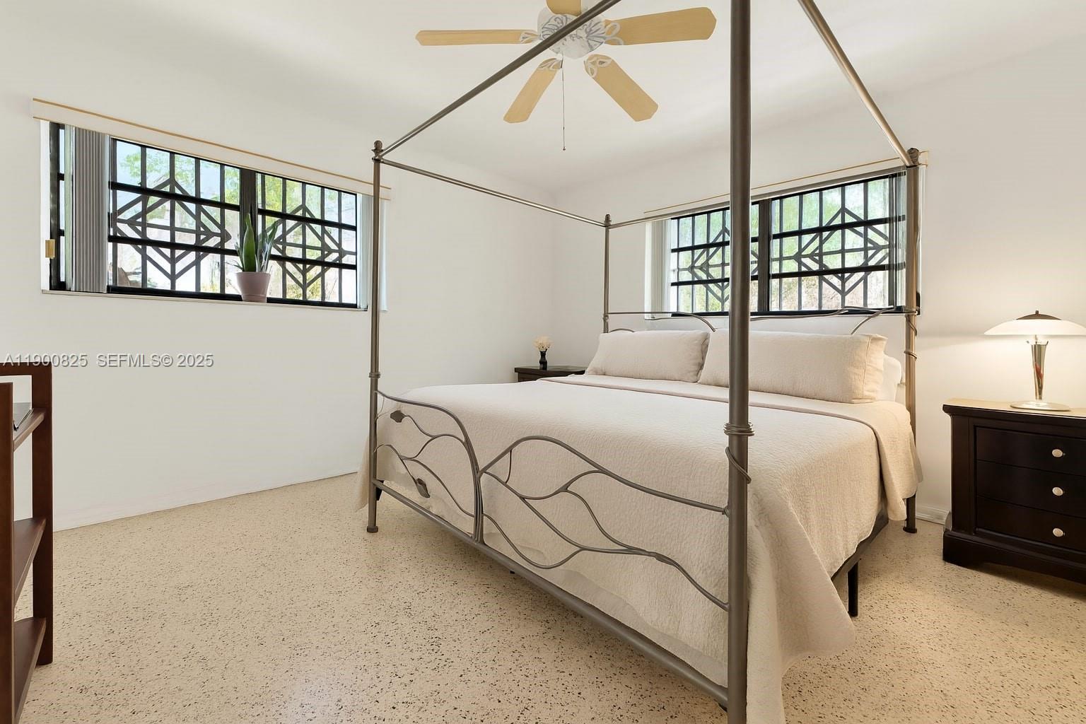 7800 Southwest 95th Street Miami, FL 33156 - Photo 6 of 17 a bedroom with a bed and a window