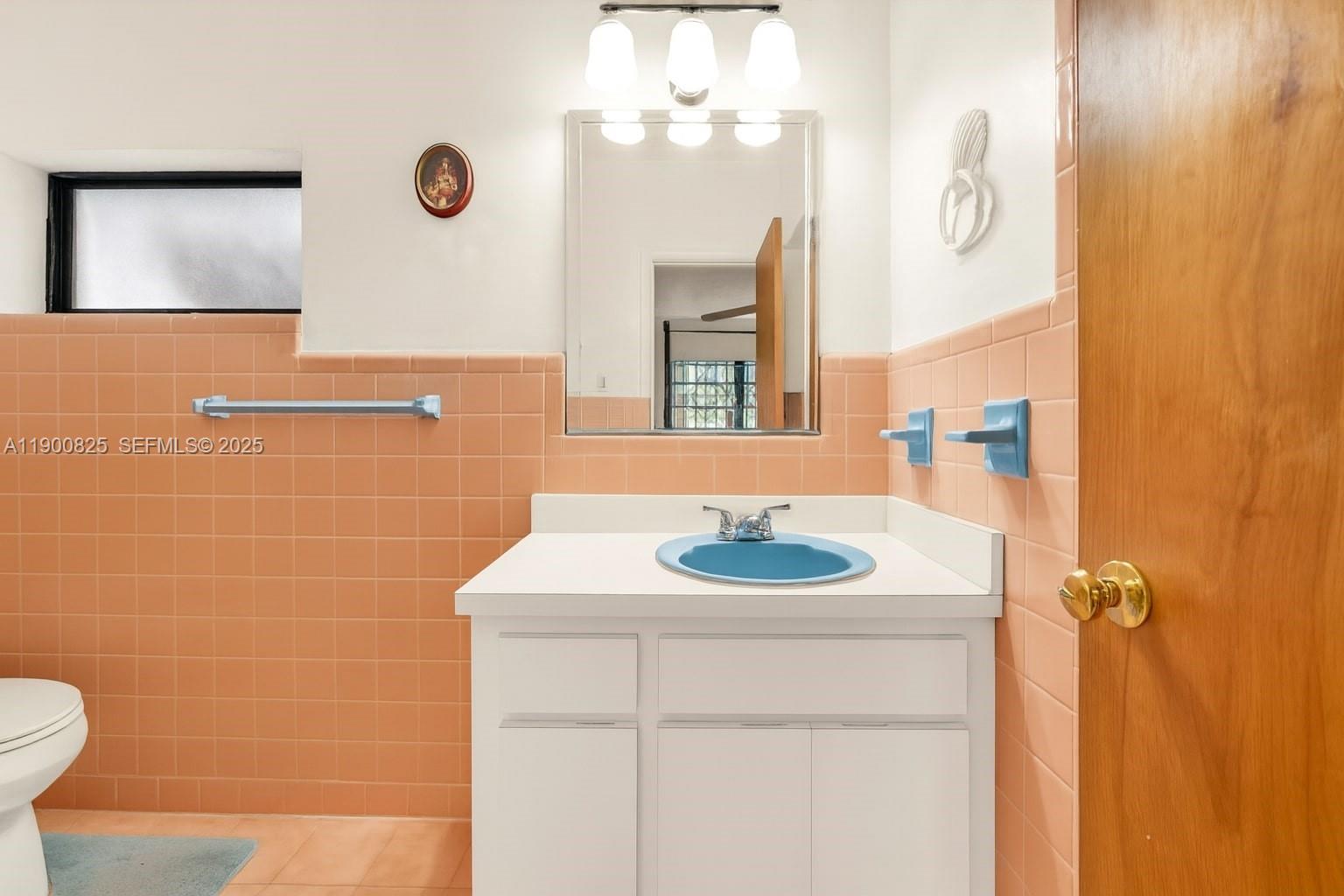 7800 Southwest 95th Street Miami, FL 33156 - Photo 7 of 17 a bathroom with a sink and a mirror