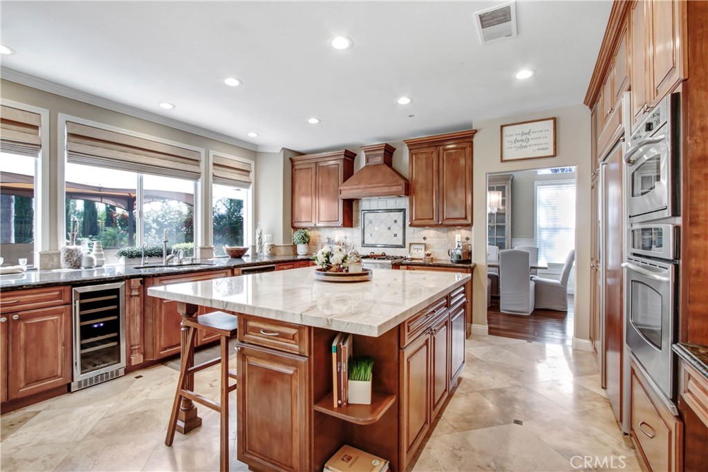 12036 Wood Ranch Road Granada Hills, CA 91344 - Photo 7 of 55 Bright & Airy Chef's Kitchen with Dual zone wine fridge