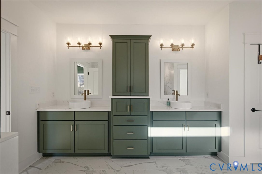 702 Hockett Road Manakin-Sabot, VA 23103 - Photo 11 of 45 a bathroom with a sink and a mirror