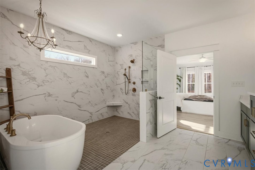 702 Hockett Road Manakin-Sabot, VA 23103 - Photo 12 of 45 a bathroom with a bathtub and shower