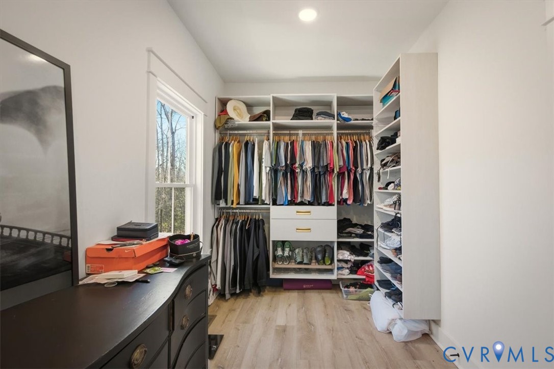 702 Hockett Road Manakin-Sabot, VA 23103 - Photo 14 of 45 a view of walk in closet with clothes and shoes