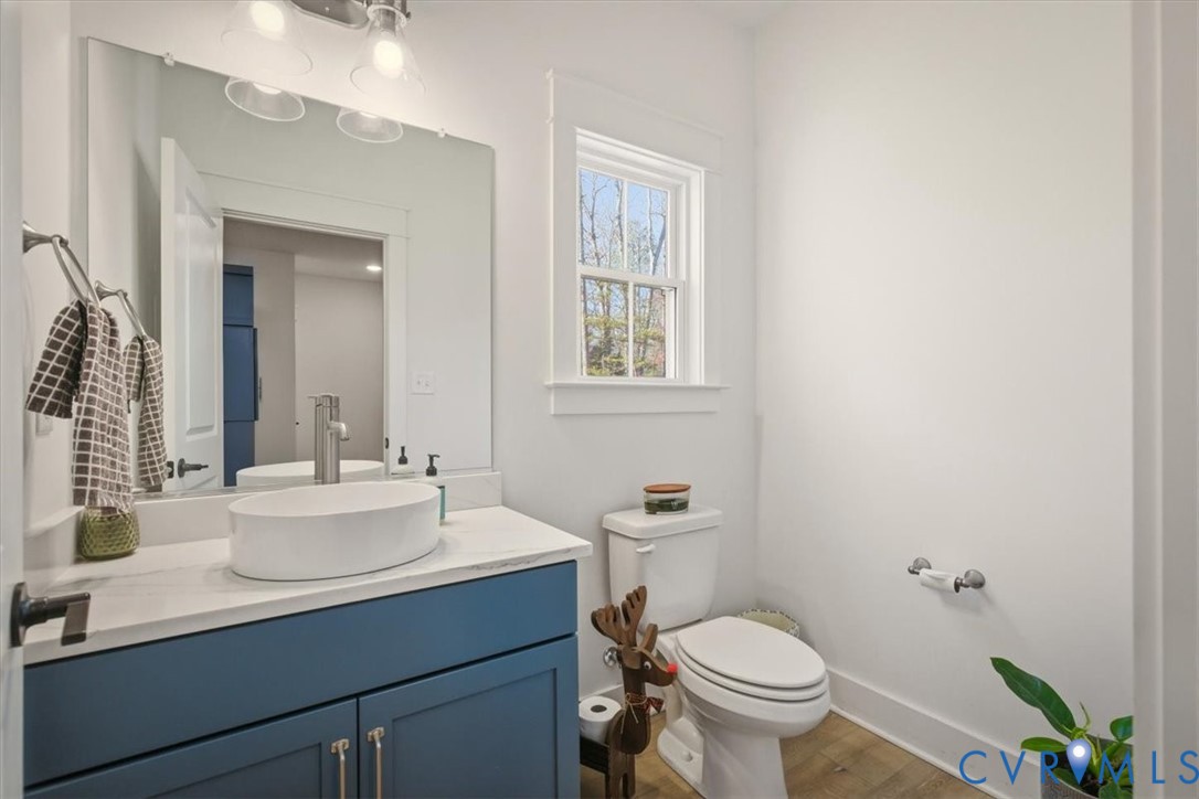 702 Hockett Road Manakin-Sabot, VA 23103 - Photo 16 of 45 a bathroom with a toilet sink and mirror