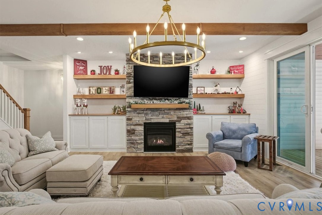 702 Hockett Road Manakin-Sabot, VA 23103 - Photo 18 of 45 a living room with furniture a flat screen tv and a fireplace