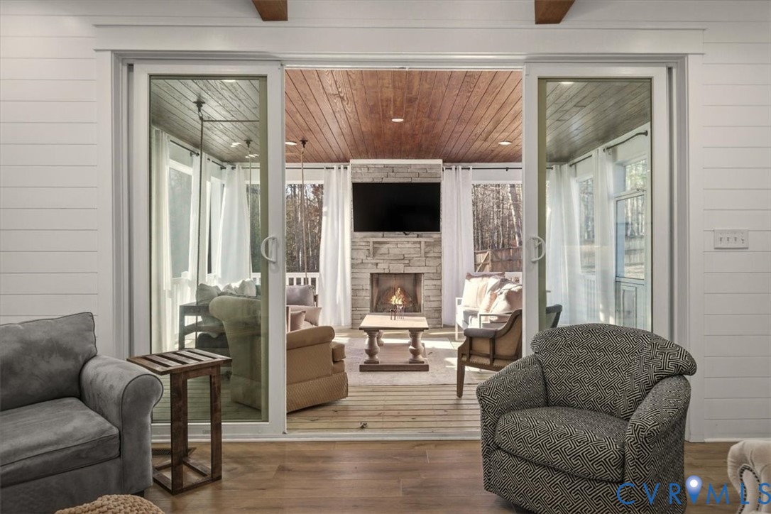 702 Hockett Road Manakin-Sabot, VA 23103 - Photo 20 of 45 a living room with furniture a fireplace and a flat screen tv