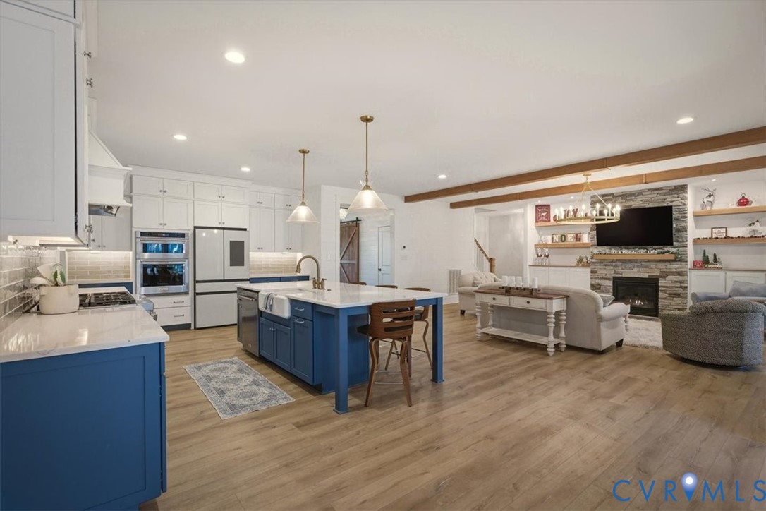 702 Hockett Road Manakin-Sabot, VA 23103 - Photo 24 of 45 a large kitchen with stainless steel appliances lots of counter space and windows
