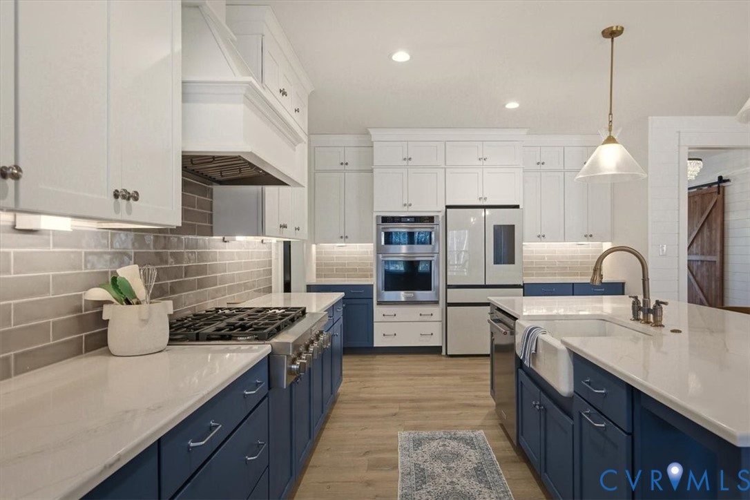 702 Hockett Road Manakin-Sabot, VA 23103 - Photo 26 of 45 a kitchen with refrigerator a sink and a stove