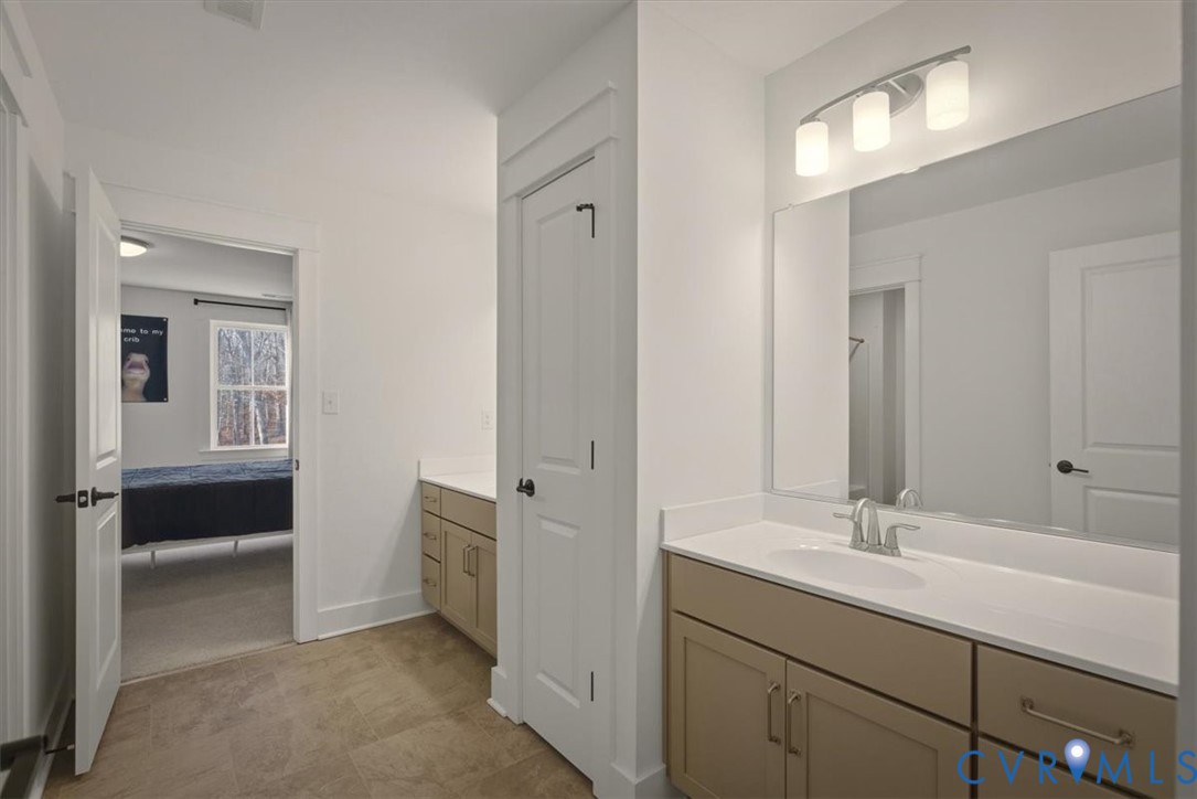 702 Hockett Road Manakin-Sabot, VA 23103 - Photo 29 of 45 a bathroom with a sink and a mirror