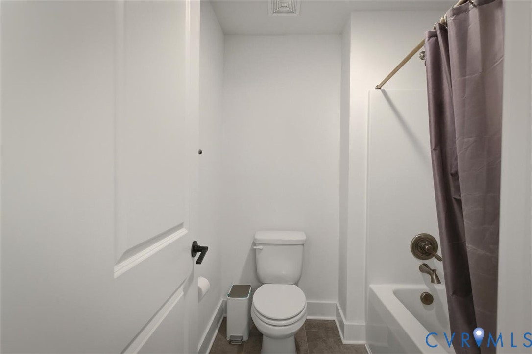 702 Hockett Road Manakin-Sabot, VA 23103 - Photo 30 of 45 a bathroom with a toilet and a tub