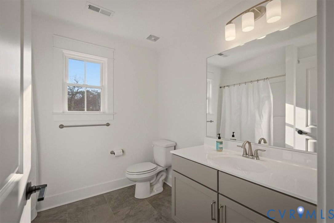 702 Hockett Road Manakin-Sabot, VA 23103 - Photo 35 of 45 a bathroom with a sink toilet and vanity