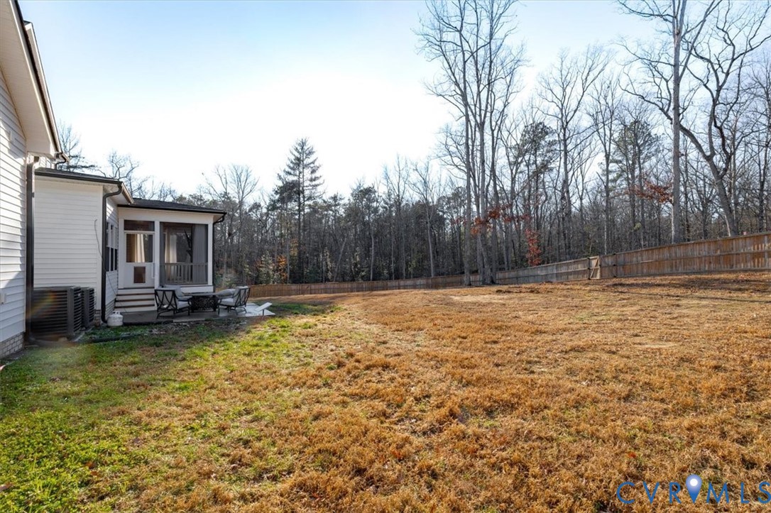 702 Hockett Road Manakin-Sabot, VA 23103 - Photo 37 of 45 a view of swimming pool with lawn chairs and wooden fence