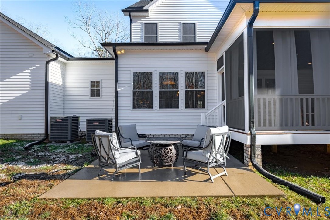 702 Hockett Road Manakin-Sabot, VA 23103 - Photo 39 of 45 a view of a patio with a table and chairs