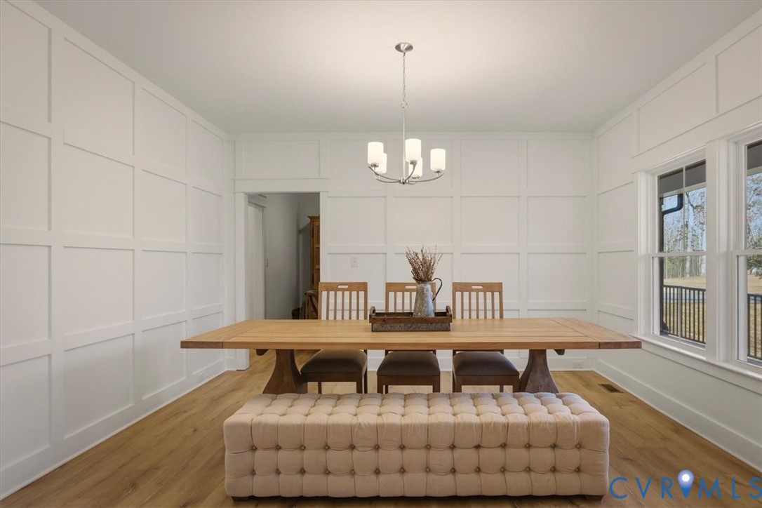 702 Hockett Road Manakin-Sabot, VA 23103 - Photo 6 of 45 a dining room with furniture and a chandelier