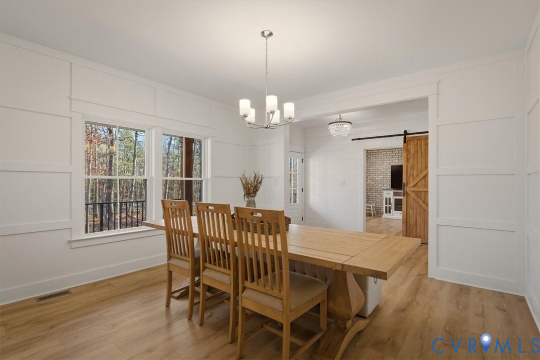 702 Hockett Road Manakin-Sabot, VA 23103 - Photo 7 of 45 a view of a dining room with furniture and wooden floor