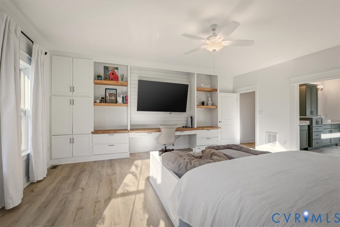 702 Hockett Road Manakin-Sabot, VA 23103 - Photo 10 of 45 a bedroom with a large bed and a flat screen tv