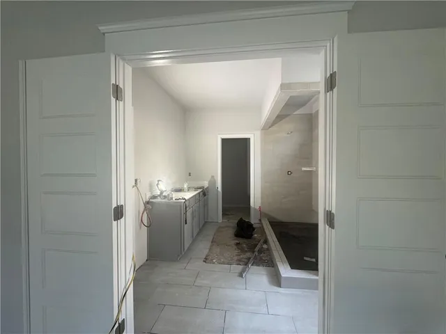 a bathroom with a sink and mirror