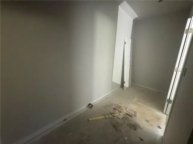 a view of an empty room with a large window