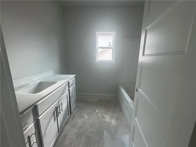 a view of storage and utility room with washer and dryer