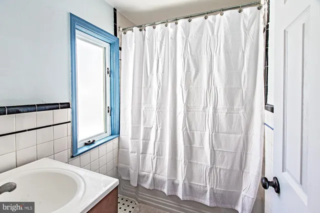 a bathroom with a sink and a bathtub