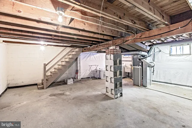 a view of an empty room with gym equipment