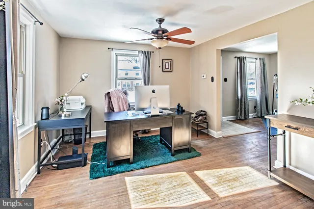 a view of a livingroom with furniture and a dining table