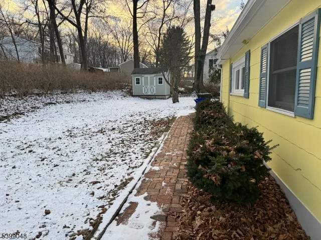 a view of a backyard of the house