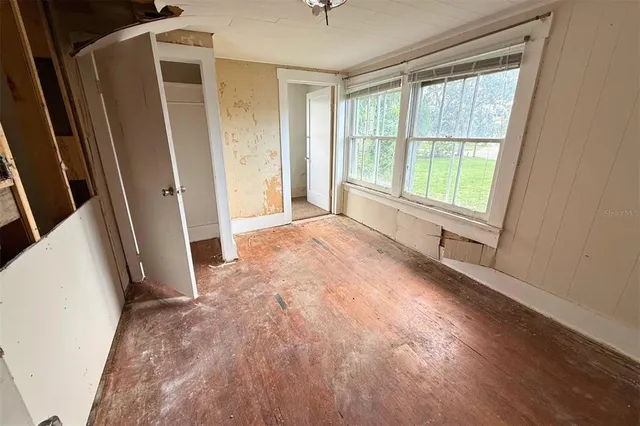 a view of an empty room with a window