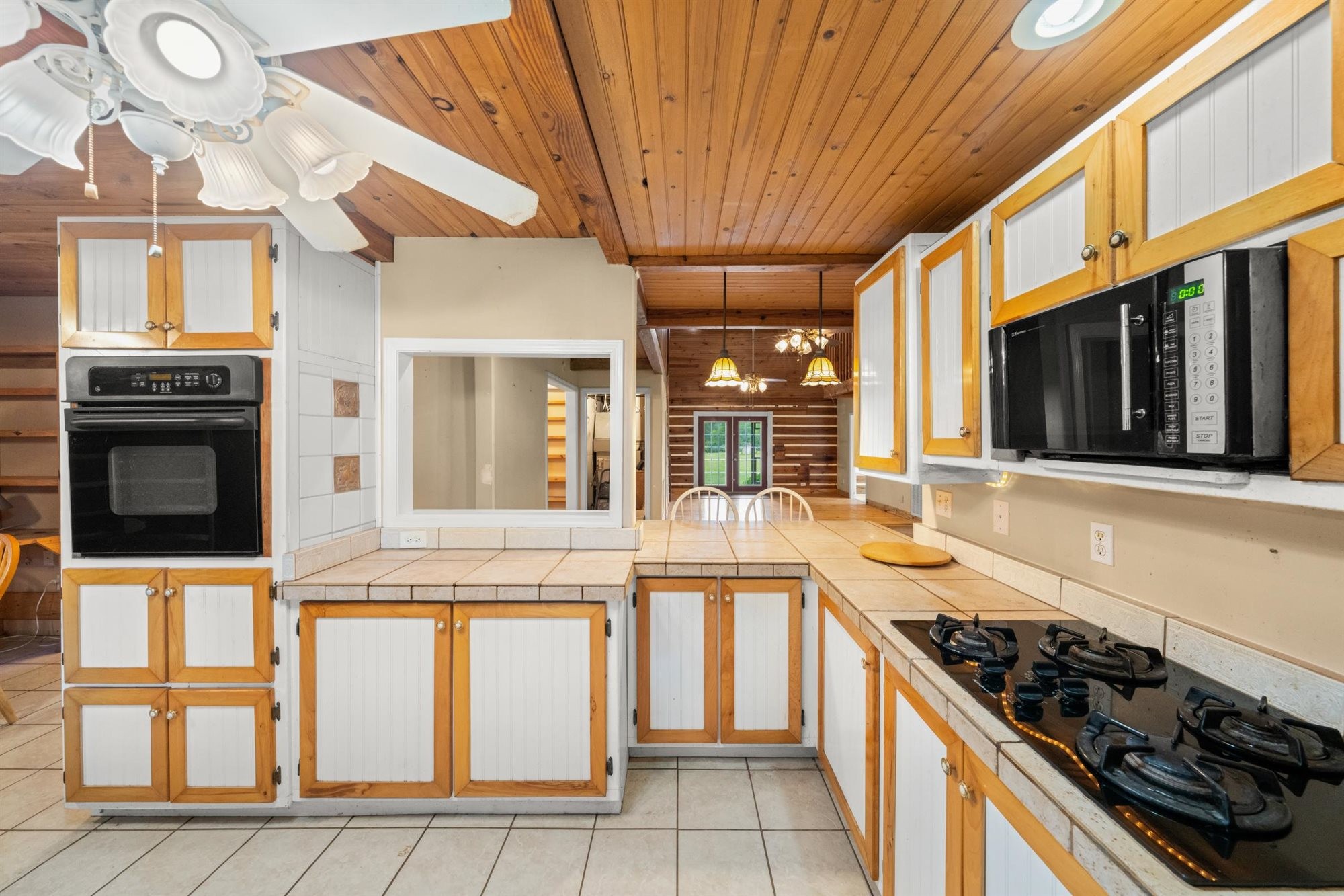 290 Lawson Town Road Crossville, TN 38572 - Photo 11 of 38 a kitchen with stainless steel appliances granite countertop a stove and a microwave