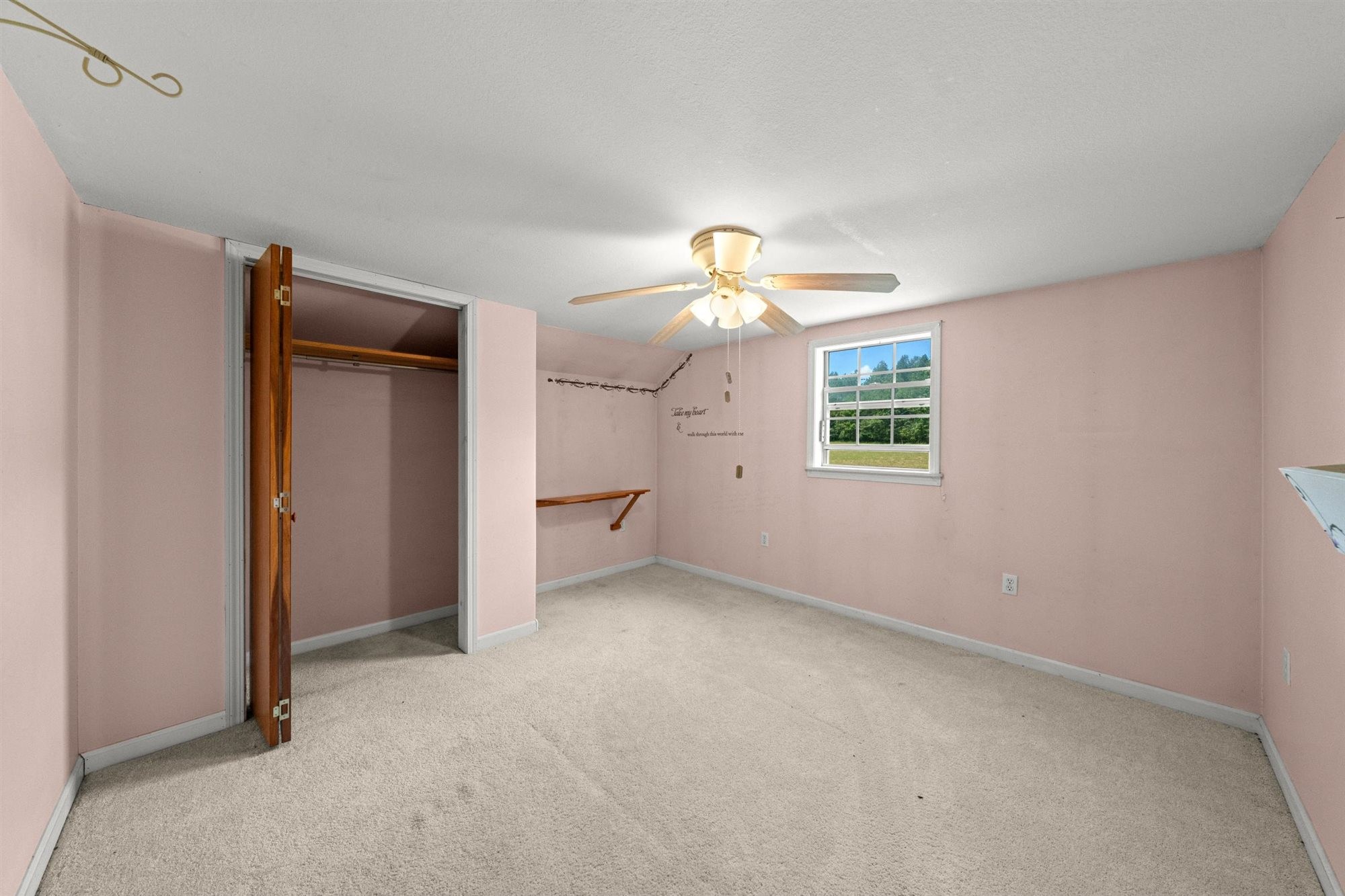 290 Lawson Town Road Crossville, TN 38572 - Photo 20 of 38 an empty room with a chandelier fan and windows