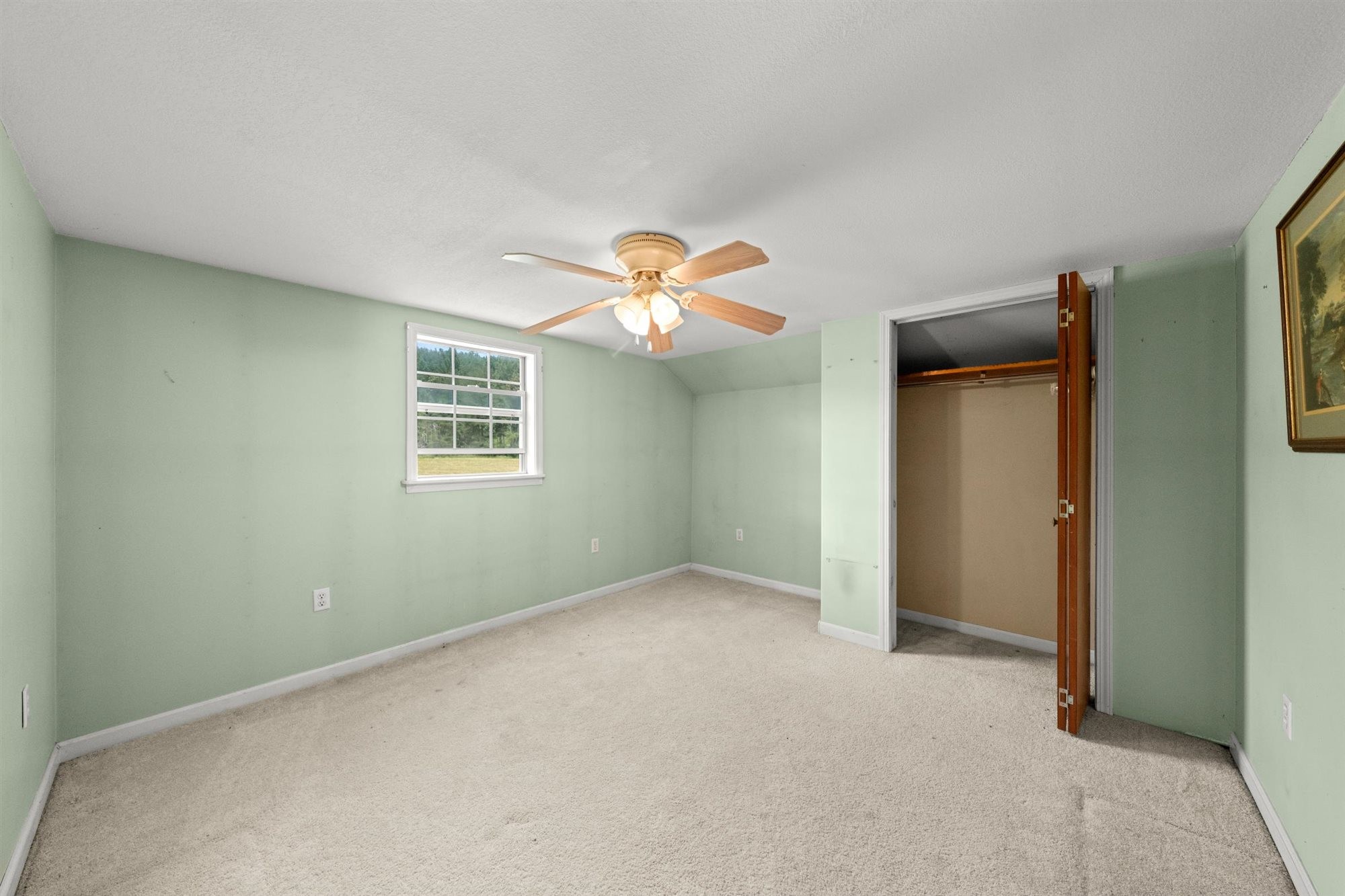 290 Lawson Town Road Crossville, TN 38572 - Photo 21 of 38 an empty room with a fan and windows