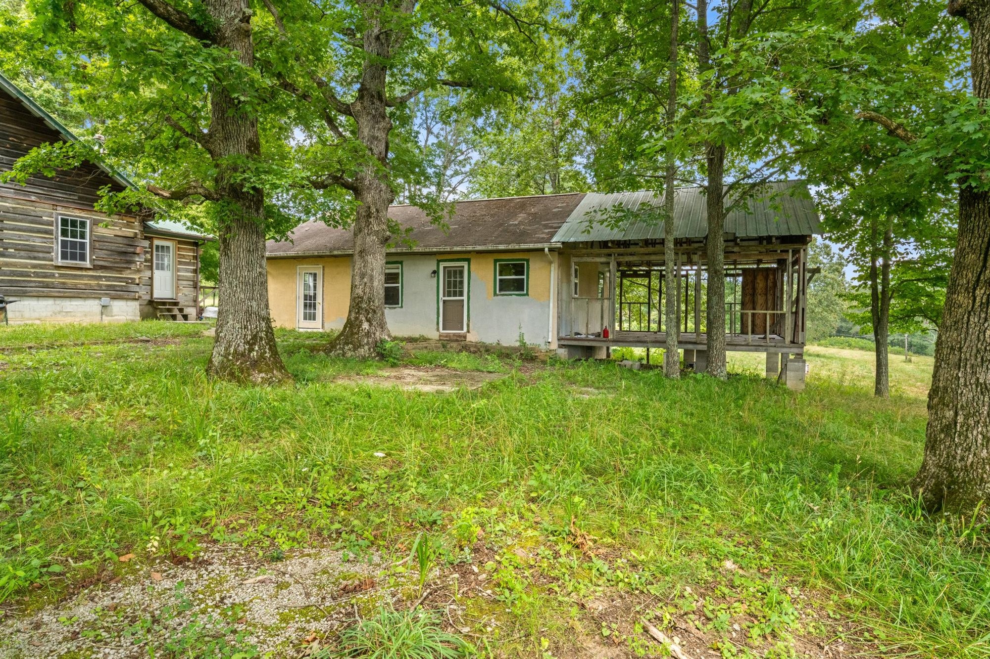 290 Lawson Town Road Crossville, TN 38572 - Photo 23 of 38 a front view of a house with a garden