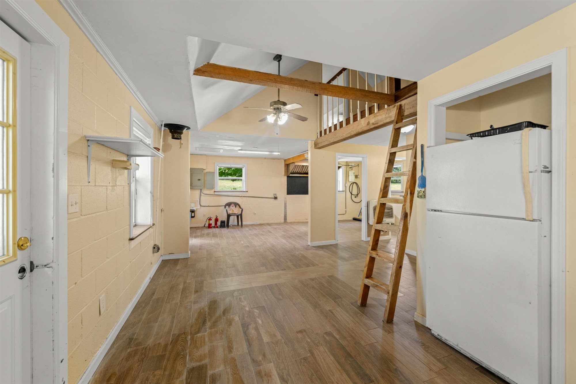 290 Lawson Town Road Crossville, TN 38572 - Photo 26 of 38 a view of a hallway with wooden floor and staircase