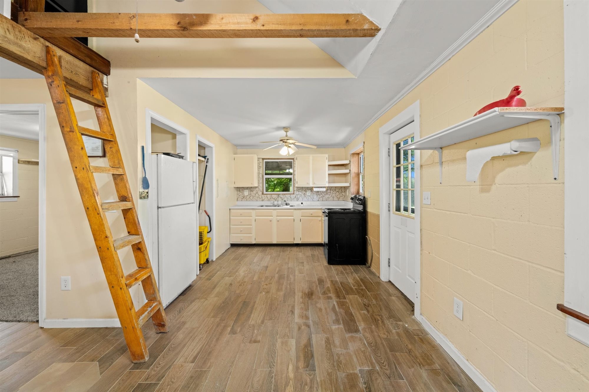 290 Lawson Town Road Crossville, TN 38572 - Photo 27 of 38 a view of a kitchen with wooden floor and electronic appliances